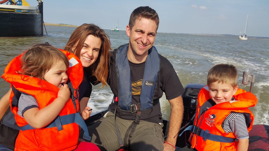 Jo, Brendan, Cuillin and Lejla Cox in their dinghy, 2015 Courtesy of Jo Cox’s family Jo and her family are pictured here at The Swale, a tidal stream near the mouth of the River Thames. The Swale was a regular destination with their boat. They would anchor in the channel, swim to the shore and play on the mudflats.